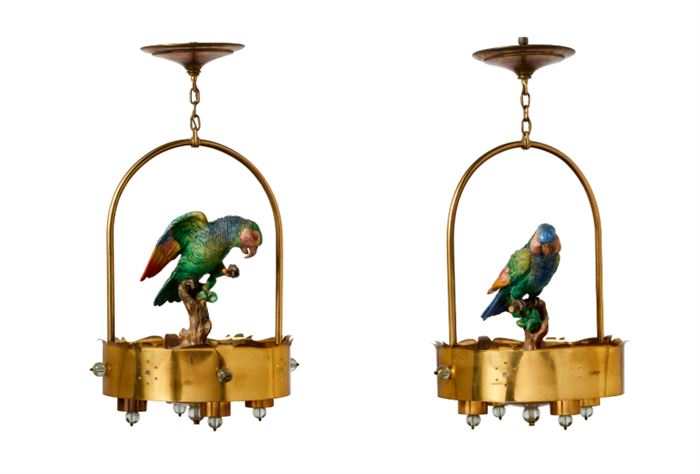 A pair of circular brass hall lights each mounted with a Continental ceramic parrot. The lights, 20th century, the parrots, late 19th/20th century.